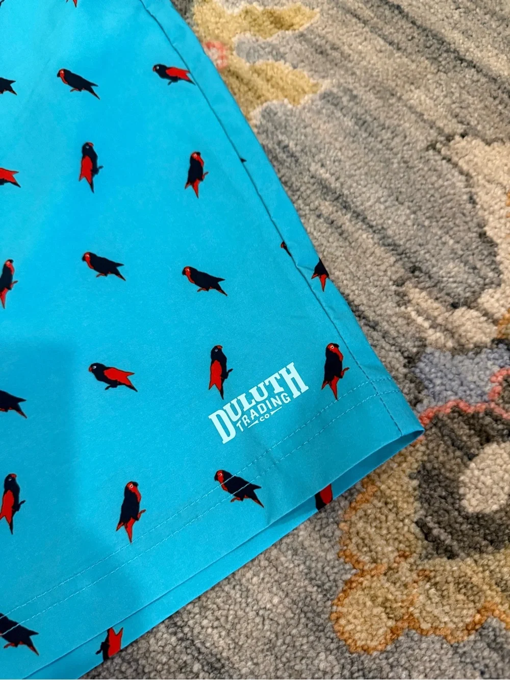 Duluth Trading Co. Men's Bull Moose parrot print board shorts in blue size 46